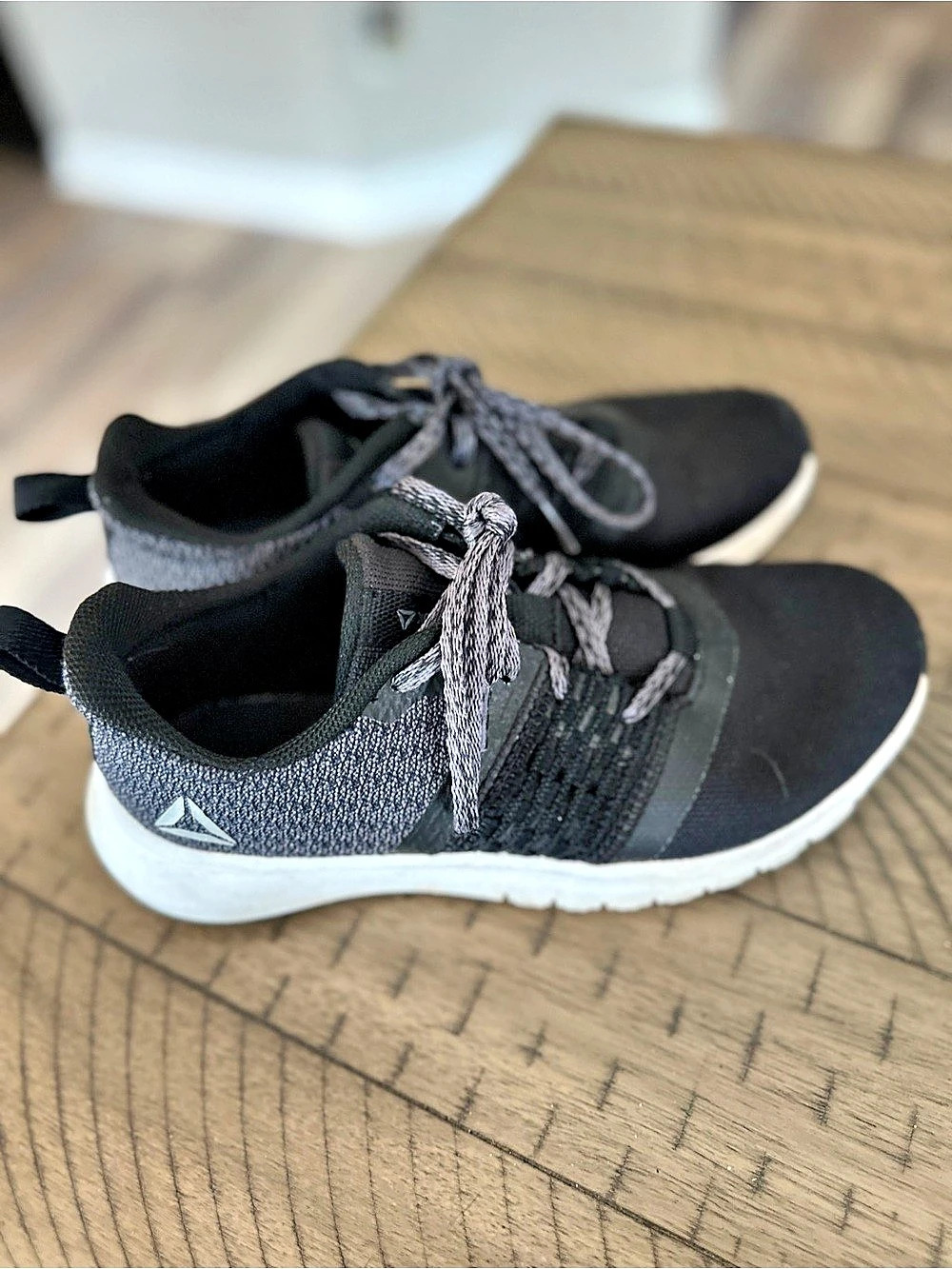 Used and well worn women’s Reebok Black Athletic Sneakers, size 7